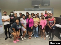 In this group of Deanwood students, Williams, director, is in the back row far right. Ayonlah Carter is in the front row third from the right. And Jordan Williams is second from the far right. (Courtesy Photo)