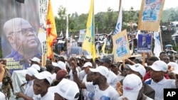 Supporters wait for the arrival of Democratic Republic of the Congo President Felix Tshisekedi at a rally in Goma, Eastern Congo, Dec. 10, 2023.