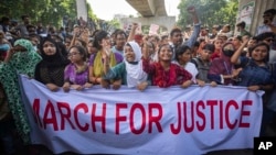 University students shout slogans during a protest to demand justice for the victims killed in the recent countrywide deadly clashes and ask for their campuses to be opened, in Dhaka, Bangladesh, July 31, 2024.