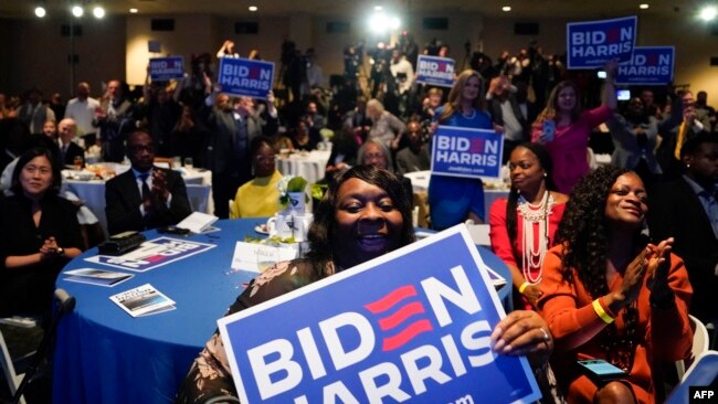 Attendees cheer as U.S. President Joe Biden speaks during the South Carolina's First in the Nation Dinner at the South Carolina State Fairgrounds in Columbia, South Carolina, Jan. 27, 2024.