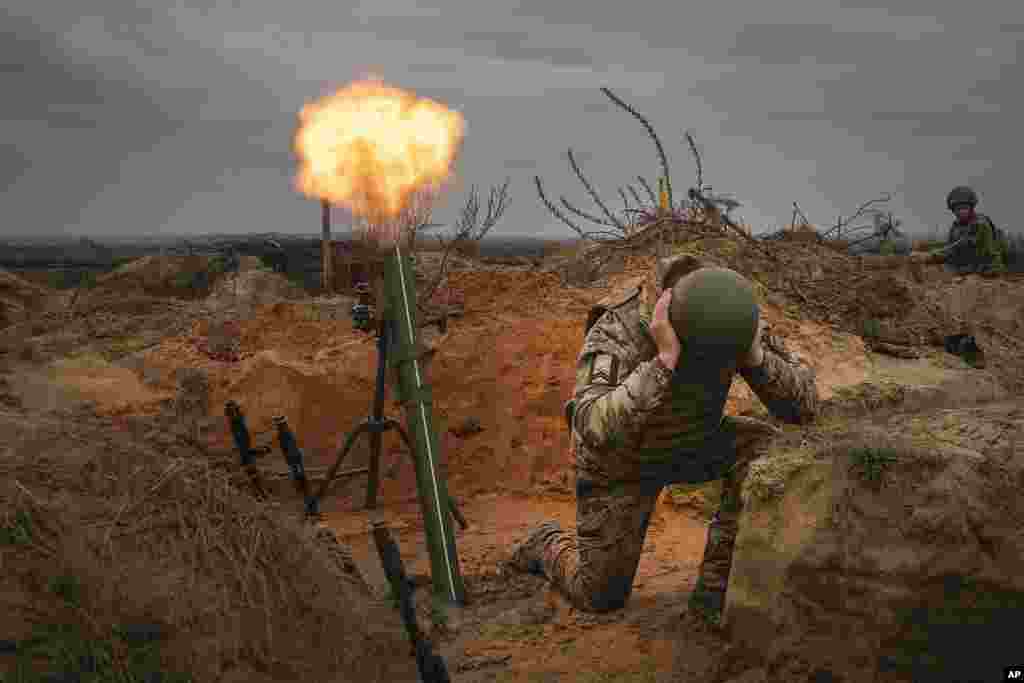 Soldiers of Ukraine's National Guard 1st brigade Bureviy practice during combat training at a military training ground in the north of Ukraine.