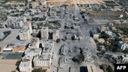 An arial view shows destroyed buildings in al-Zahra city south of Gaza City following Israeli bombardment during the Israel-Hamas war, Oct. 20, 2023. Many Muslims in Nigeria have marched to show support of Palestinians and to show opposition to Israel's bombardments of Gaza.