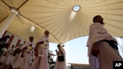 Pilgrims walk at the Hajj terminal of King Abdulaziz International Airport in Jeddah, Saudi Arabia, June 20, 2023.