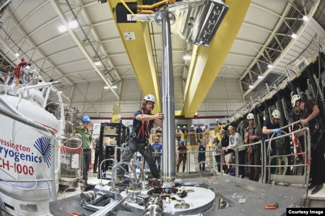 Scientists from the Antihydrogen Laser Physics Apparatus (ALPHA) project in Geneva, Switzerland carry out experiments on antimatter. (Image Credit: European Center for Nuclear Research/CERN)