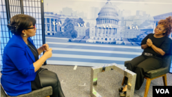 Burkinabe journalist Mariam Ouedraogo, right, is seen during an interview with Salem Solomon at VOA headquarters in Washington.