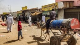 FILE: People at the Souk Sitta (Market Six) in the south of Khartoum on June 1, 2023. Shelling and aerial bombardments killed 18 civilians at a market in Sudan's capital where fighting showed no signs of abating on June 1, after the army abandoned truce talks.