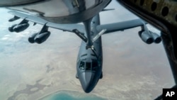 FILE - A U.S. Air Force B-52H is refueled in the U.S. Central Command area of responsibility, Dec. 30, 2020. The U.S. European Command said Sunday a U.S. military aircraft crashed into the Mediterranean Friday during an air refueling training mission. (U.S. Air Force via AP)