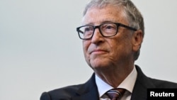 FILE - Microsoft founder Bill Gates reacts during a visit with Britain's Prime Minister Rishi Sunak of the Imperial College University, in London, Feb. 15, 2023.