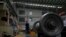FILE - A worker checks on a cargo train wheel at the GEMAC Engineering Machinery, a China-based company, during a media-organized tour in Xiangyang in central China's Hubei Province, May 10, 2023. 
