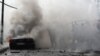 Lebanese firefighters put out a fire in a car after an Israeli strike in the southern city of Sidon, Aug. 21, 2024.