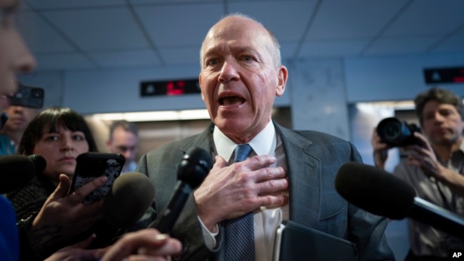 Boeing CEO Dave Calhoun speaks briefly with reporters after a meeting in the office of Sen. Mark Warner, D-Va., at the Capitol in Washington, Jan. 24, 2024.