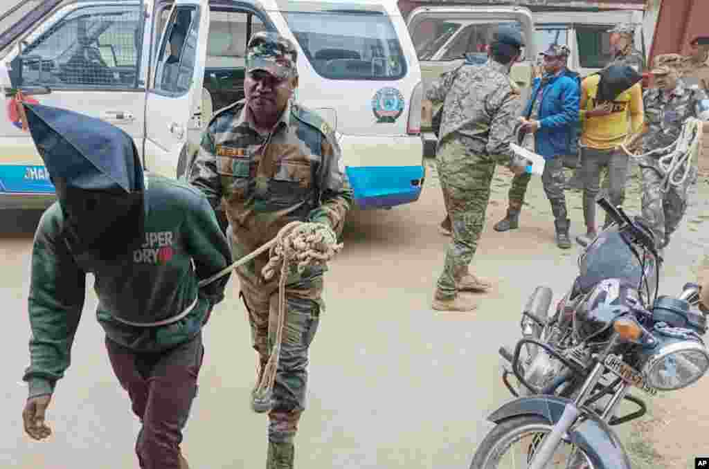 Three men arrested for the alleged gang rape of a Spanish tourist are brought by police to be produced before the Dumka District Court in Dumka, Jharkhand, India.