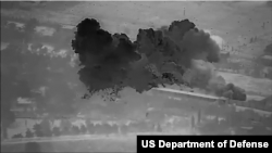 This still image from a U.S. Department of Defense video shows an airstrike on a Mayadin, Syria, facility used to launch attacks on U.S. troops.