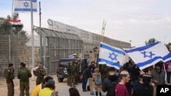 Protesters block the path for humanitarian aid bound for the Gaza Strip at the Nitzana border crossing with Egypt in southern Israel, Feb. 2, 2024. 