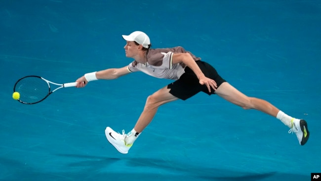 Jannik Sinner of Italy hits a forehand to Daniil Medvedev of Russia during the men's singles final at the Australian Open tennis championships at Melbourne Park, in Melbourne, Jan. 28, 2024.