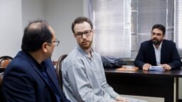 Swedish EU diplomat Johan Floderus (C) attends a court session in Tehran on Dec. 10, 2023. The Swede who works for the EU diplomatic service, was arrested on Apr. 17, 2022, at Tehran airport as he was returning home from a trip with friends.