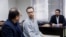 Swedish EU employee Johan Floderus (C) attends a court session in Tehran on Dec. 10, 2023. The Swede who works for the EU diplomatic service, was arrested on Apr. 17, 2022, at Tehran airport as he was returning home from a trip with friends.