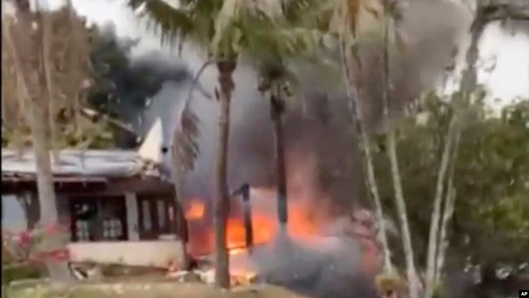 This frame grab from video shows fire coming from a plane that crashed by a home in Vinhedo, Sao Paulo state, Brazil, Aug. 9, 2024.
