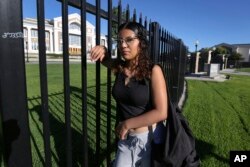 Melinda Gonzalez, 14, poses at Fresno High School where she'll be a freshman in Fresno, Calif., Aug. 14, 2024.