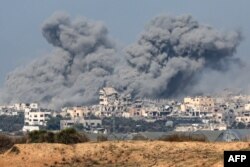 A picture taken from southern Israel near the border with the Gaza Strip, Dec. 6, 2023, shows smoke billowing during Israeli bombardment in Gaza amid continuing battles between Israel and the militant group Hamas.