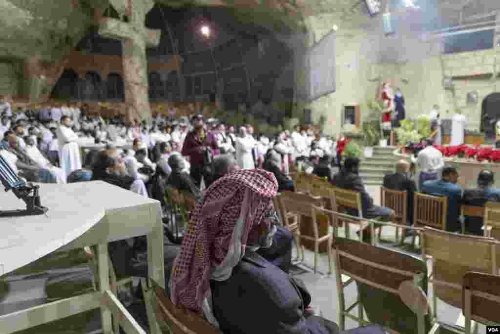 A Coptic man wearing a keffiyeh, or traditional Arab scarf, sits in prayer. Many this Christmas are reflecting on the unprecedented humanitarian crisis across the border in Gaza as Israel&#39;s siege shows no signs of letting up. Cairo, Egypt, Jan. 6, 2024.