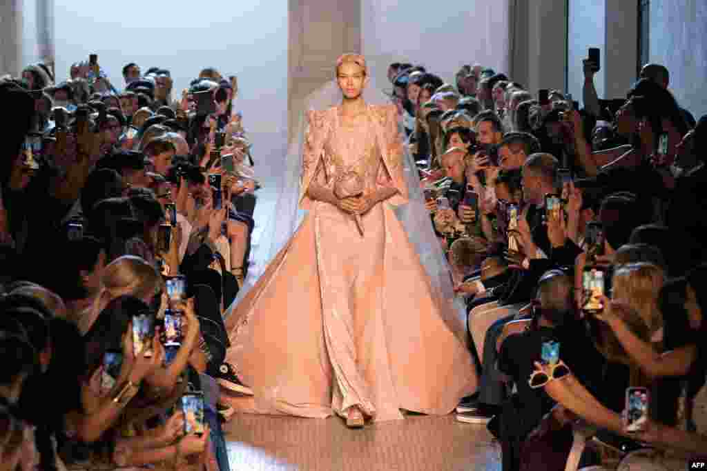 A model presents a creation by Elie Saab during the Women&#39;s Haute-Couture Fall/Winter 2023/2024 Fashion Week in Paris.