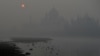 The Taj Mahal is seen amid heavy smog as the sun rises in Agra, India, on Nov. 9, 2023.