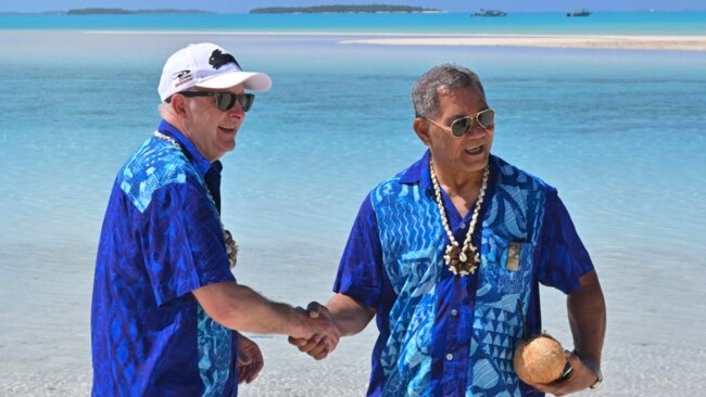 Australia's Prime Minister Anthony Albanese, left, and Tuvalu's Prime Minister Kausea shake hands on One Foot Island after attending the Leaders' Retreat during the Pacific Islands Forum in Aitutaki, Cook Islands, Nov. 9, 2023.