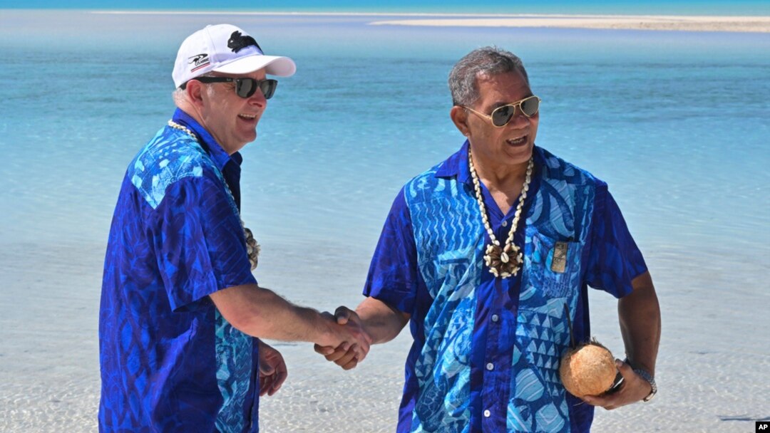 Australia's Prime Minister Anthony Albanese, left, and Tuvalu's Prime Minister Kausea shake hands on One Foot Island after attending the Leaders' Retreat during the Pacific Islands Forum in Aitutaki, Cook Islands, Nov. 9, 2023.