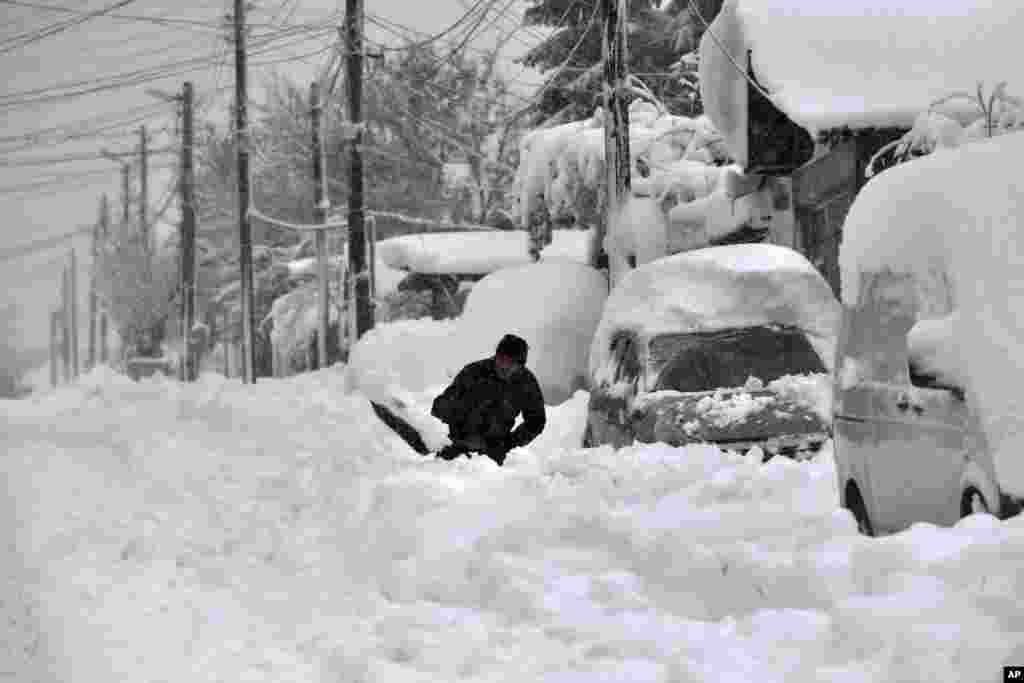 A man shovels snow in Isperih, Northeast Bulgaria.&nbsp;Bulgaria&#39;s government declared a state of emergency in large parts of the Balkan country after heavy snow and powerful winds caused power outages, closed roads, traffic accidents and travel delays.&nbsp;