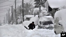 A man shovels snow in Isperih, Northeast Bulgaria.&nbsp;Bulgaria&#39;s government declared a state of emergency in large parts of the Balkan country after heavy snow and powerful winds caused power outages, closed roads, traffic accidents and travel delays.&nbsp;