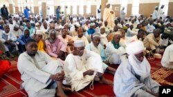 FILE - Muslim faithful listen to a sermons by an Imam before traditional Friday prayers at the Moddibo Adama Mosque in Yola, Nigeria, Feb. 24, 2023. 