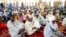 FILE - Muslim faithful listen to a sermons by an Imam before traditional Friday prayers at the Moddibo Adama Mosque in Yola, Nigeria, Feb. 24, 2023. 