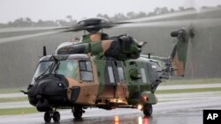 In this photo provided by the Australian Defence Force, an Australian Army MRH-90 Taipan helicopter from the School of Army Aviation prepares to take off from Ballina airport, Ballina, Australia, Feb 27, 2022.