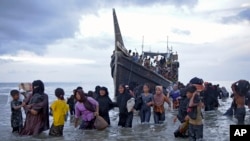 Rohingya Muslims disembark from their boat in Ulee Madon, North Aceh, Indonesia, Nov. 16, 2023. The U.N. refugee agency, Dec. 4, 2023, sounded the alarm for hundreds of Rohingya Muslims believed to be aboard two boats reported to be out of supplies and adrift on the Andaman Sea.