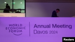 A person walks inside the venue, on the first day of the annual World Economic Forum meeting in Davos, Switzerland, Jan. 15, 2024