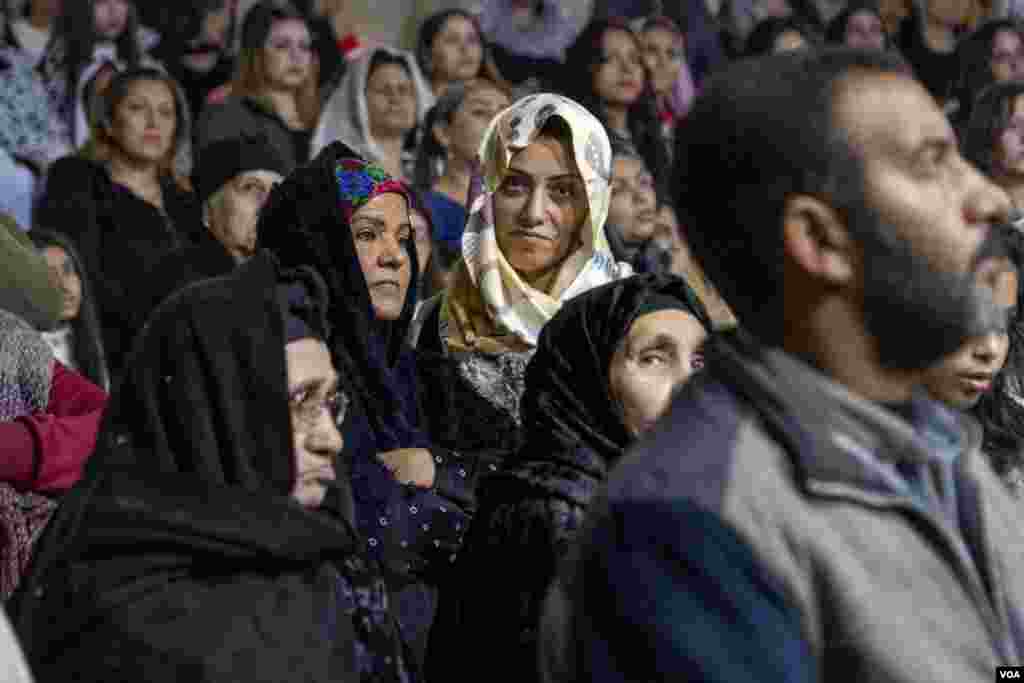 Coptic women hear a Christmas Eve sermon following a year of record-high inflation and deepening cost-of-living and debt crises that the newly reelected general-turned-president Abdel Fattah El-Sissi presides over. Cairo, Egypt, Jan. 6, 2024.