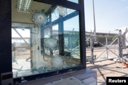 FILE - Damaged glass is seen at the Erez crossing point, in Israel, Jan. 5, 2024.
