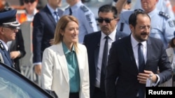 Cyprus President Nikos Christodoulides and European Parliament President Roberta Metsola take part in a military parade marking Cyprus' Independence Day in Nicosia, Cyprus, Oct. 1, 2023. 