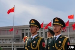 Chinese honor guards prepare for the arrival of Mali's interim president Assimi Goita at Beijing Capital International Airport in Beijing on Sept. 1, 2024.