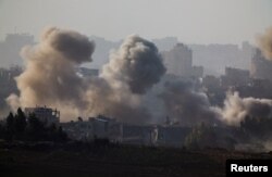 Smoke rises after Israeli air strikes in north Gaza, as seen from southern Israel, amid the ongoing conflict between Israel and the Palestinian group Hamas, Nov. 23, 2023.