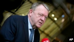 Denmark's Foreign Minister Lars Lokke Rasmussen speaks with the media as he arrives for a meeting of EU foreign ministers at the European Council building in Brussels, March 20, 2023.