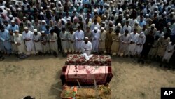 Relatives and mourners attend the funeral prayer of victims who were killed in Sunday's suicide bomber attack in the Bajaur district of Khyber Pakhtunkhwa, Pakistan, July 31, 2023.