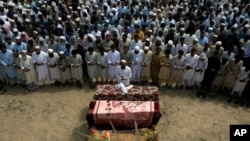 FILE - Relatives and mourners attend the funeral of victims who were killed in a suicide bomber attack in the Bajaur district of Khyber Pakhtunkhwa, Pakistan, July 31, 2023.