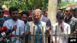 Nobel laureate and chief adviser of Bangladesh's new interim government, Muhammad Yunus (C) visits slain Abu Sayeed's house, who was killed by police during the anti-quota protests, in Rangpur on Aug. 10, 2024. 