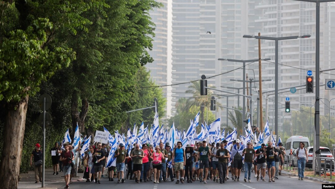 People demonstrate on the 'Day of National Resistance' in protest against Israeli Prime Minister Benjamin Netanyahu and his nationalist coalition government's judicial overhaul, in Tel Aviv, July 18, 2023.