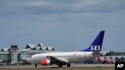 A Scandinavian Airlines medevac plane, believed to be carrying Norway's King Harald, is seen at Langkawi international airport on the Malaysian resort island of Langkawi, Malaysia, March 3, 2024.