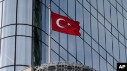 FILE - The flag of Turkey flies above Turkish House, which has the Consulate General of Turkey and Turkey's Permanent Mission to the United Nations, in New York, Nov. 17, 2023.