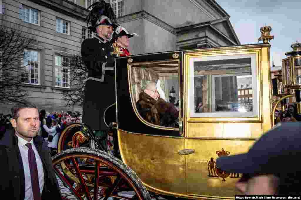 Denmark&#39;s Queen Margrethe is escorted by the Gardehusar Regiment&#39;s Horseskort in the golden carriage in Copenhagen.