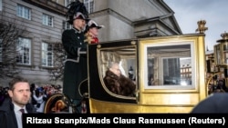 Denmark&#39;s Queen Margrethe is escorted by the Gardehusar Regiment&#39;s Horseskort in the golden carriage in Copenhagen.